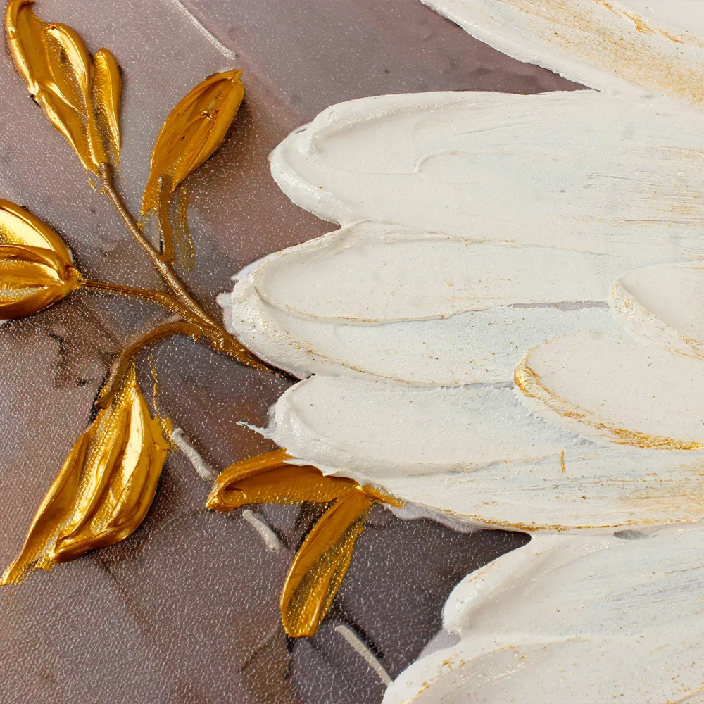 Detail shot of gilded textured leaves on floral artwork