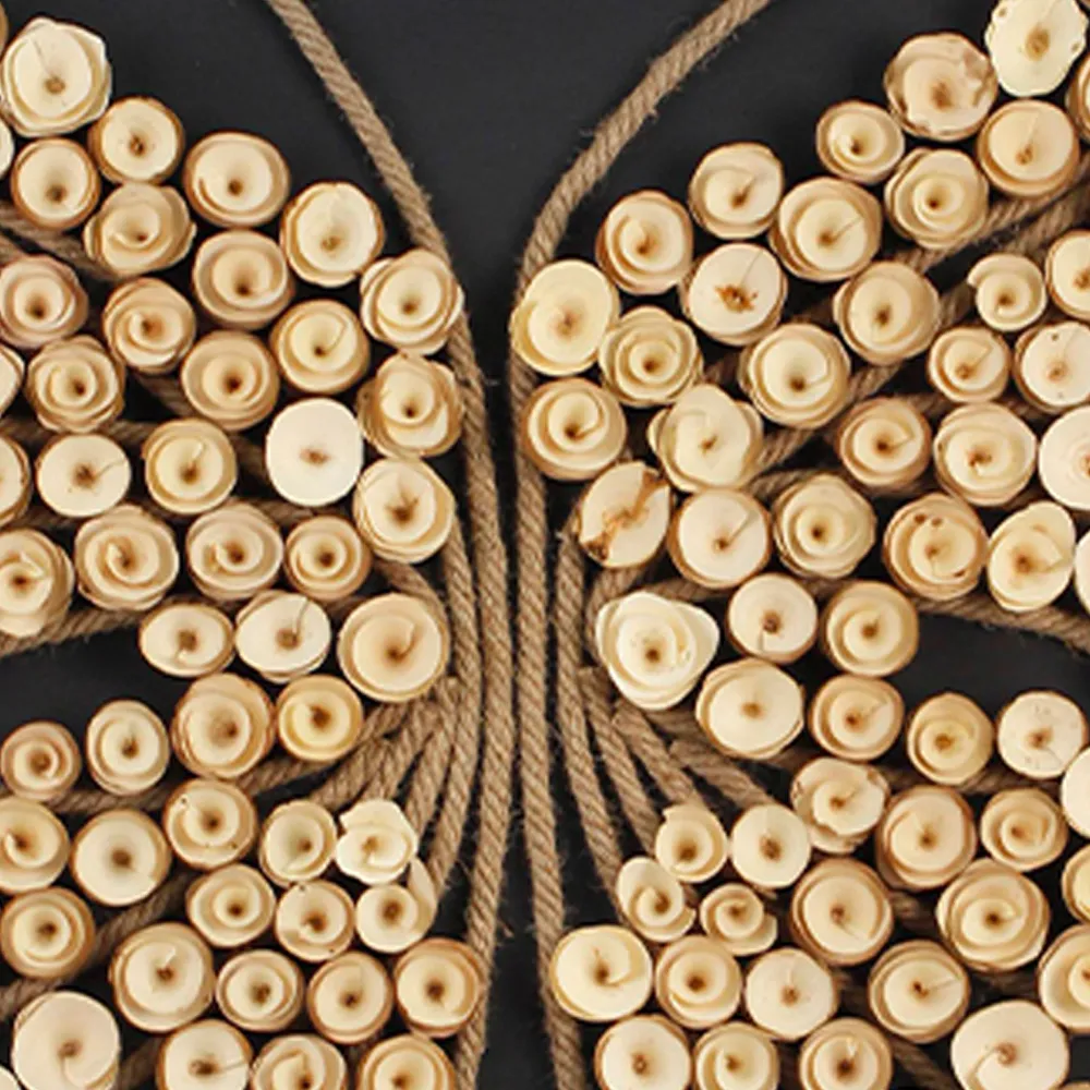 Detail close‑up of wooden butterfly wall art, natural wood slice texture, jute rope antenna, handmade splicing texture of 3D wall artwork