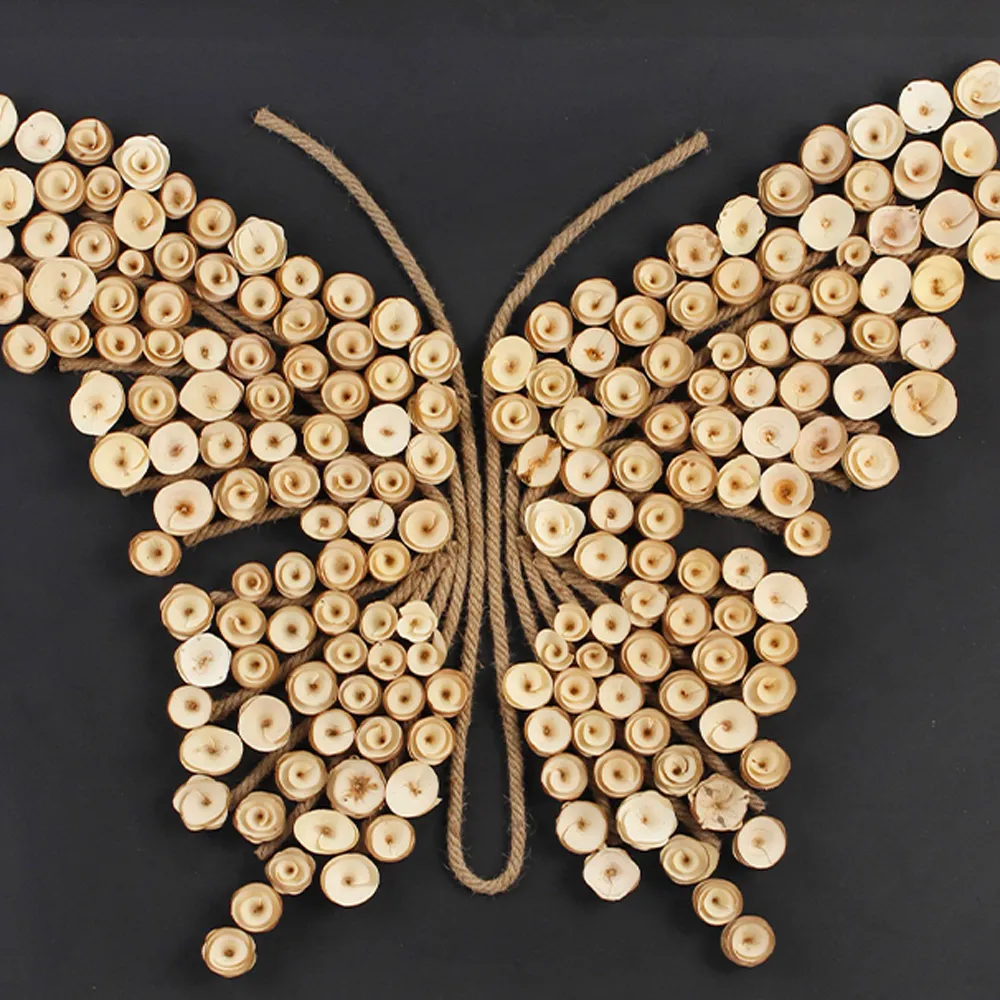 Close‑up of handmade wood slice &amp; jute rope butterfly wall decor, natural wood chips assembled into butterfly shape, black background board, handmade art wall piece